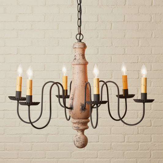 Chandelier with wooden base and candle-style lights on a white background