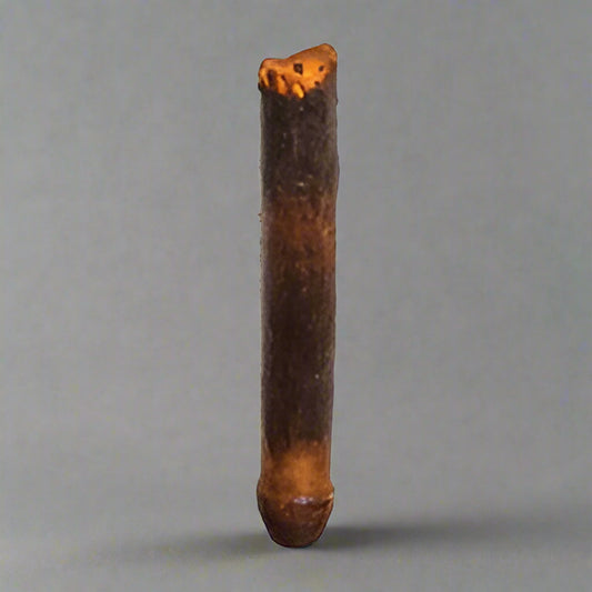 Taper candleholder on gray background