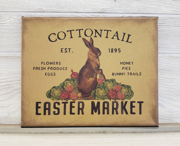 Vintage-style sign with a rabbit illustration and text on a wooden surface