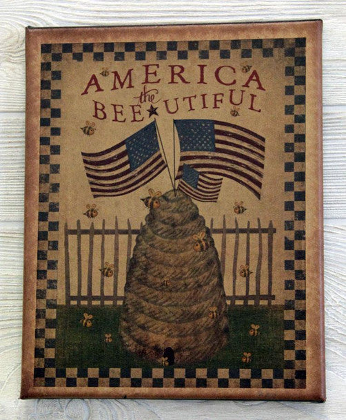 A canvas print featuring a bee with American flags, titled 'America the Beeutiful', with a patriotic design including a fence and flowers.