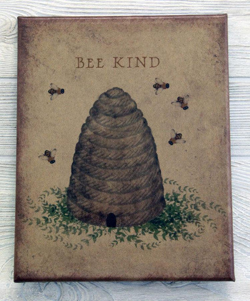 Canvas print with a beeskep surrounded by flying bees with the words "Bee Kind" above the illustration