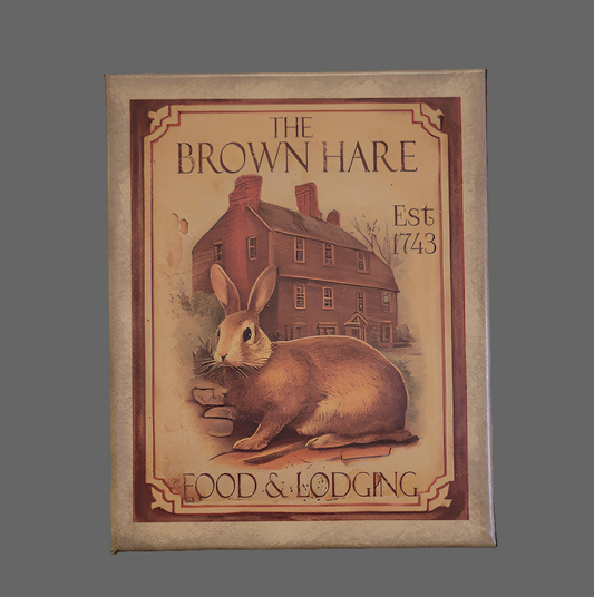 A canvas print featuring a vintage-style illustration of a brown hare in front of a house, with 'The Brown Hare' text above and 'Food & Lodging' below.
