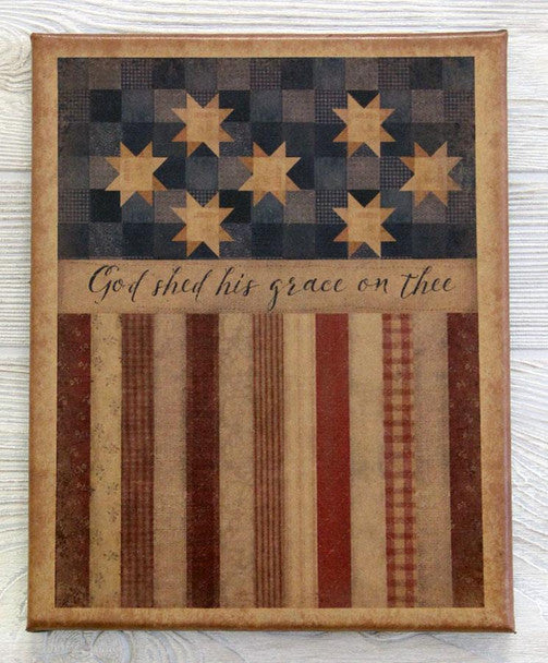 Canvas print with a quilted flag design with the words "God shed his grace on thee"