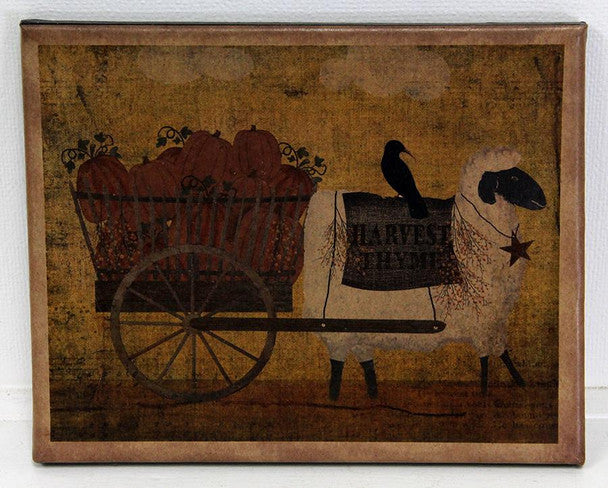 Canvas print with a sheep pulling a wagon of pumpkins