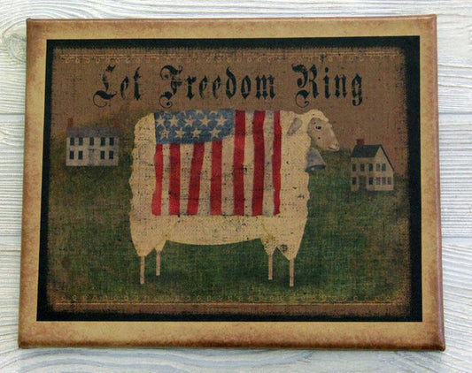 A canvas print featuring a sheep with an American flag-like pattern in the background, and the text 'Let Freedom Ring' at the top.