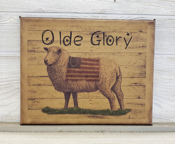A canvas print featuring a sheep with an American flag in the background, and the text 'OLD GLORY' prominently displayed.
