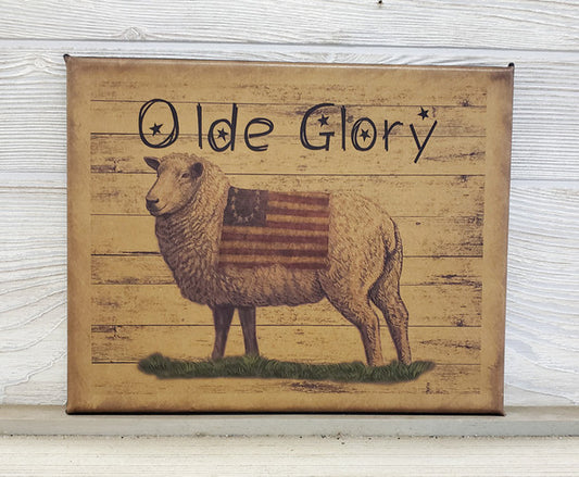 A canvas print featuring a sheep with an American flag in the background, and the text 'OLD GLORY' prominently displayed.
