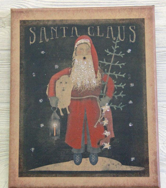 Canvas print featuring Santa Claus holding a sheep, tree and lantern