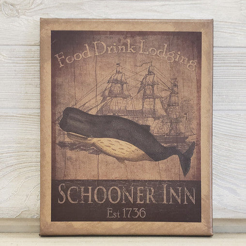 A canvas print featuring an illustration of a whaling ship with a whale, titled 'Food Drink Lodging' and 'Schooner Inn', established 1756.