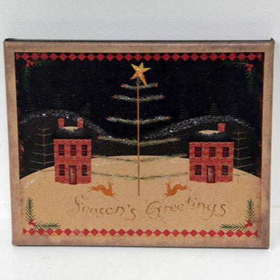 An 8x10 canvas print featuring a winter scene with cabins, a Christmas tree, and holiday greetings.