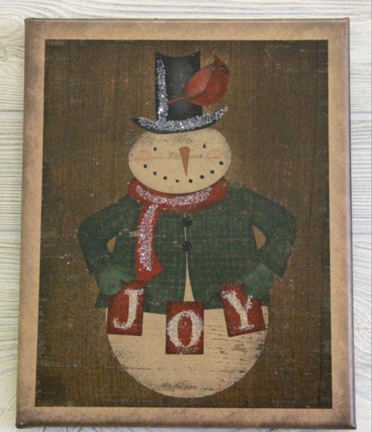 Canvas print depicting a snowman dressed in a top hat with a cardinal sitting on his hat