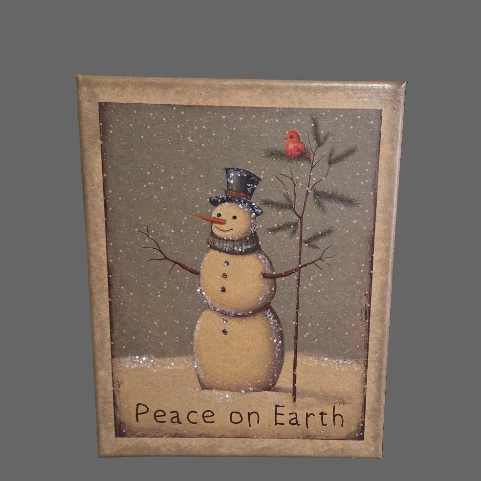 An 8x10 canvas print featuring a snowman with a 'Peace on Earth' message, surrounded by a Christmas-themed design including a red bird and greenery.
