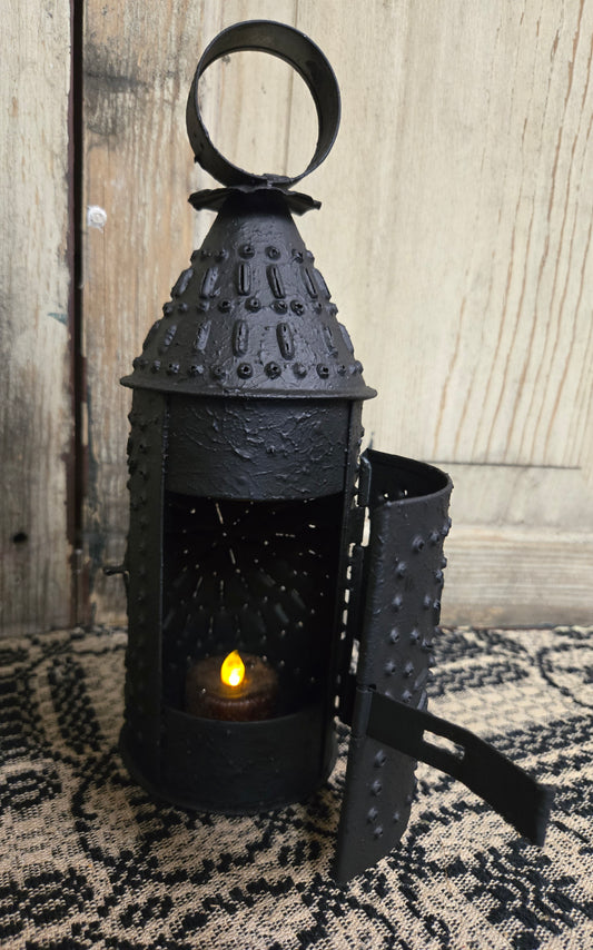 A petite 9-Inch Revere Lantern with a textured black finish, designed for use with a battery operated tea light.