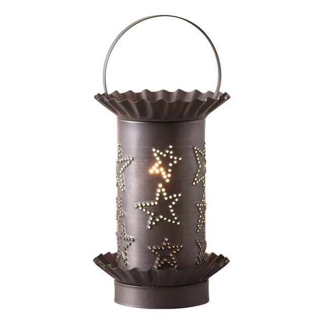 A black mini tartwarmer with a kettle design and star embellishments, featuring a removable lid and a light bulb inside.