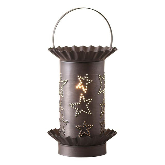 A black mini tartwarmer with a kettle design and star embellishments, featuring a removable lid and a light bulb inside.