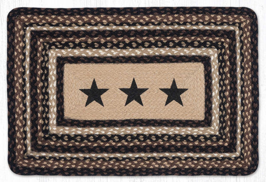 A rectangular braided jute rug with a rustic western design, featuring three black stars in the center on a beige background, surrounded by concentric braided borders in black, brown, and beige.