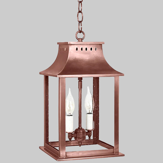 Copper hanging lantern with two light bulbs on a white background