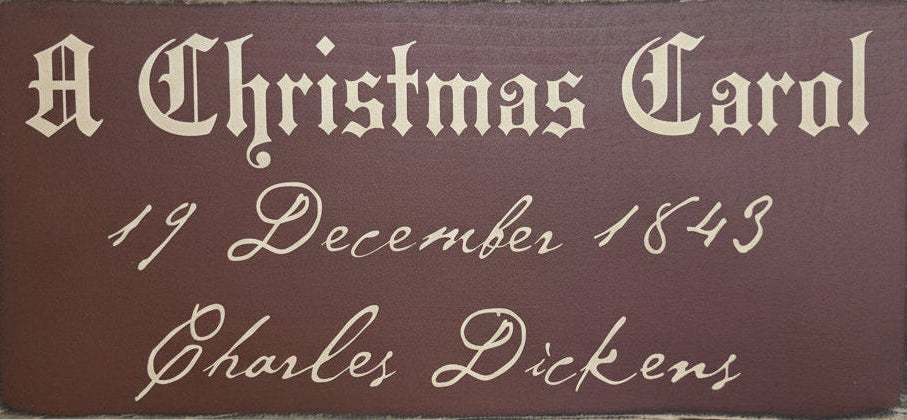 Plaque with 'A Christmas Carol' text on a brown background