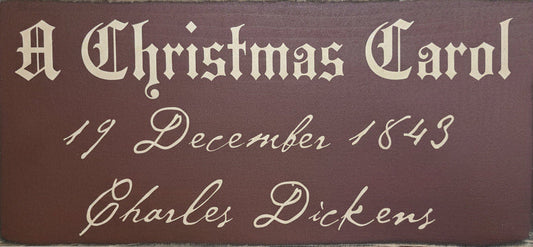 Plaque with 'A Christmas Carol' text on a brown background