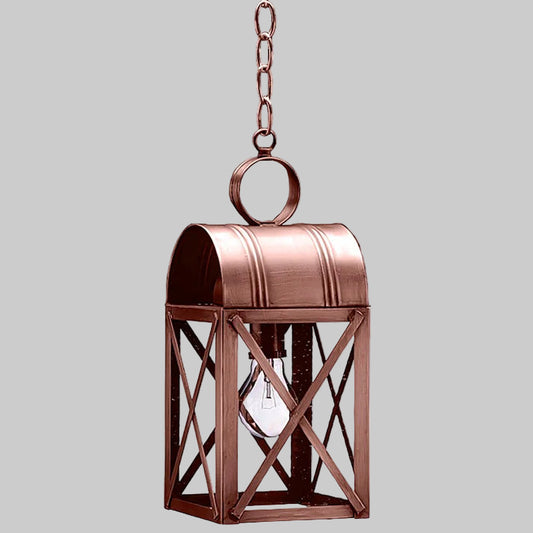 Copper hanging lantern with a light bulb inside on a gray background