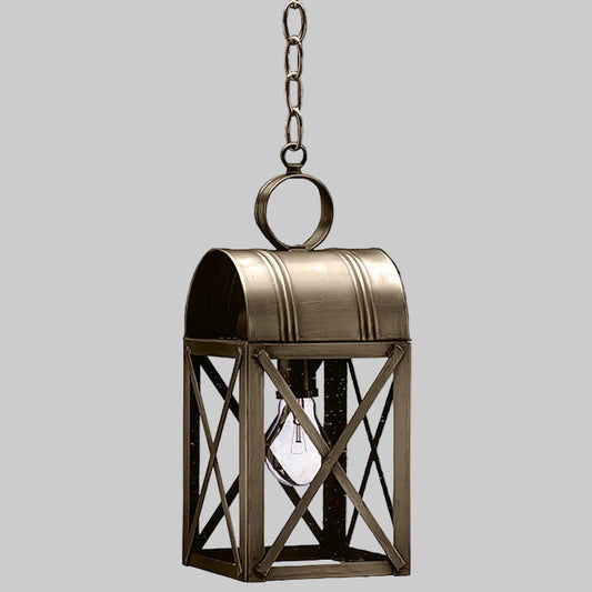 Bronze hanging lantern with a light bulb inside on a gray background