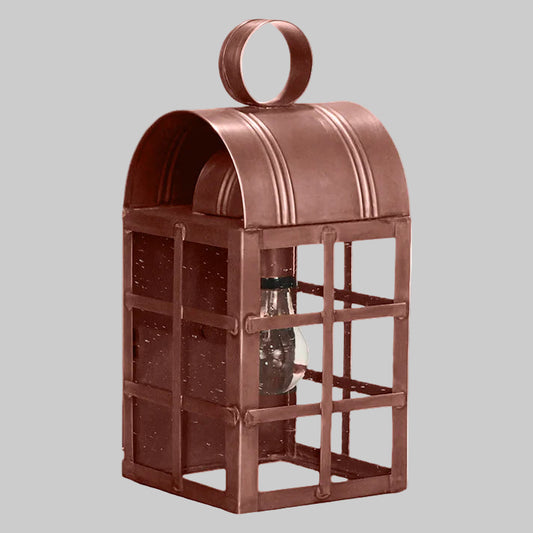 Brown metal lantern with a light bulb inside on a white background