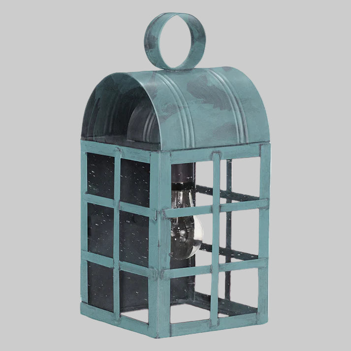 Teal metal lantern with grid design on a white background