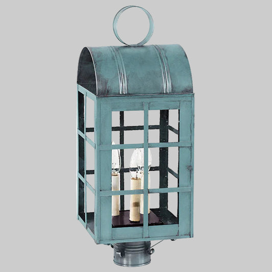 Teal outdoor lantern with glass panels on a gray background