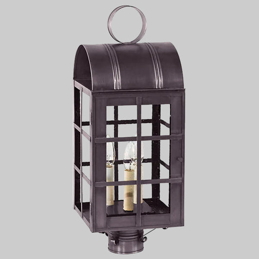 Decorative outdoor lantern with glass panels on a gray background