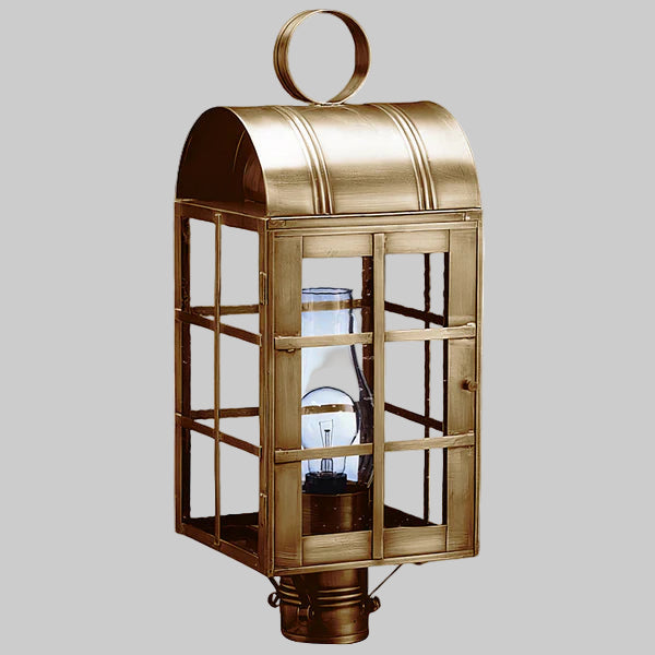 Bronze lantern with glass panels on a gray background