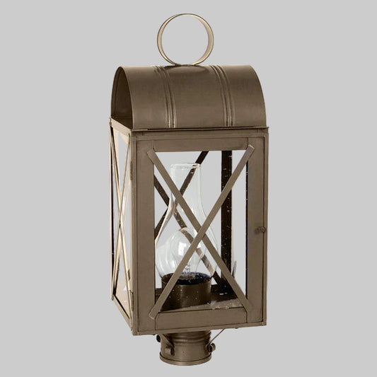 Bronze outdoor wall lantern with clear glass on a gray background