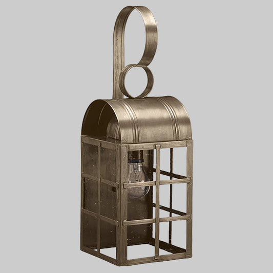 Decorative metal lantern with a handle on a gray background