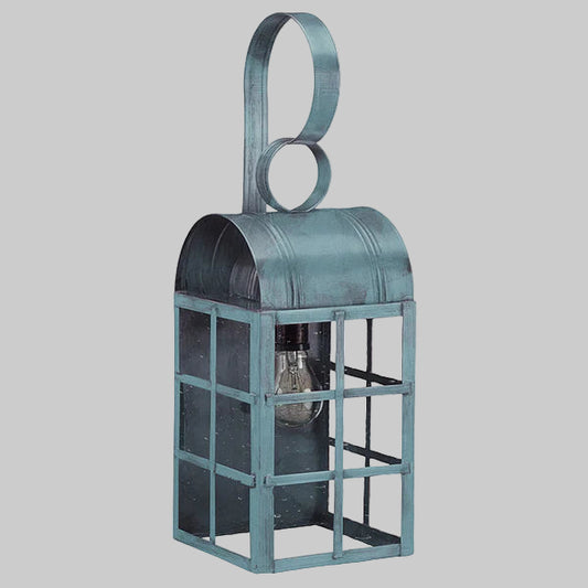 Vintage-style metal lantern with a hanging loop on a gray background
