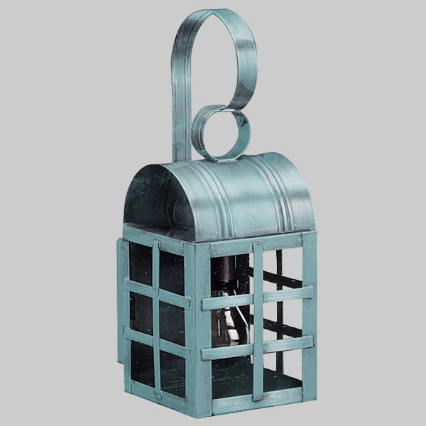 Teal metal lantern with a handle on a gray background