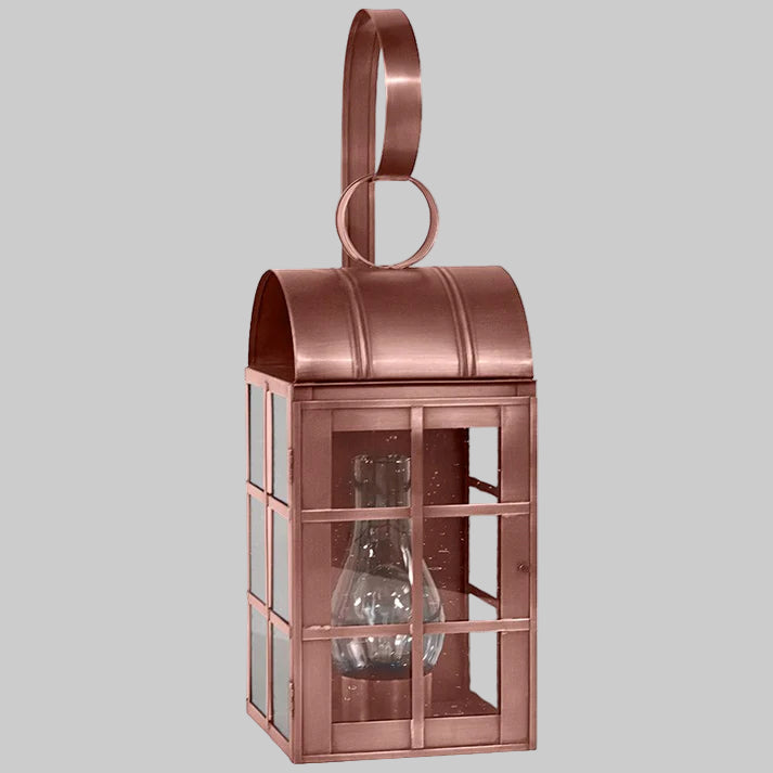 Copper lantern with glass panels on a gray background