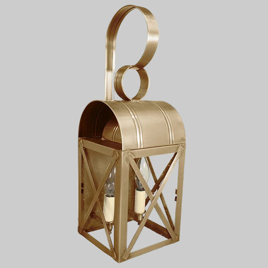 Gold lantern with circular design on a gray background