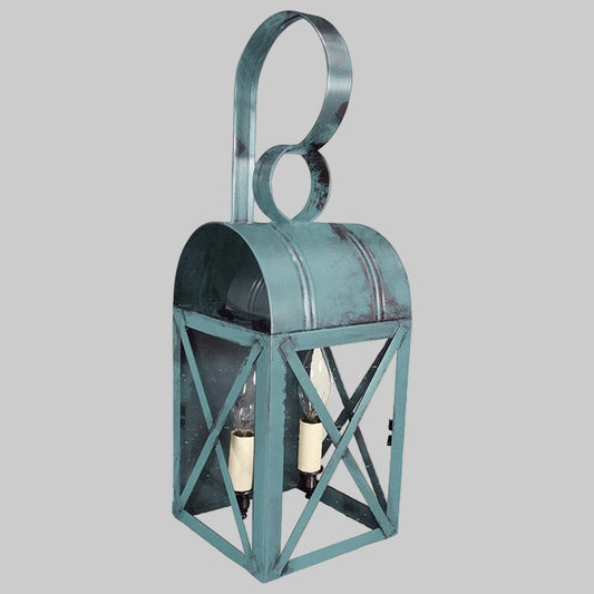 Decorative teal lantern with a handle on a gray background