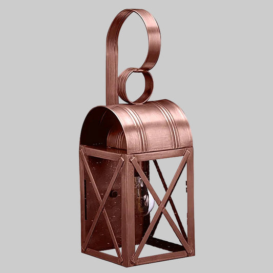 Copper lantern with a ring on top against a gray background
