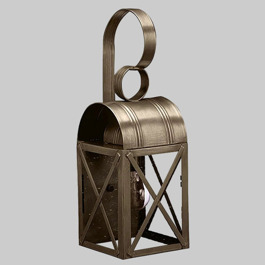 Bronze lantern with circular top design on a gray background