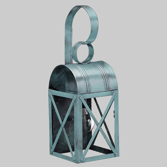 Decorative metal lantern with a handle on a gray background