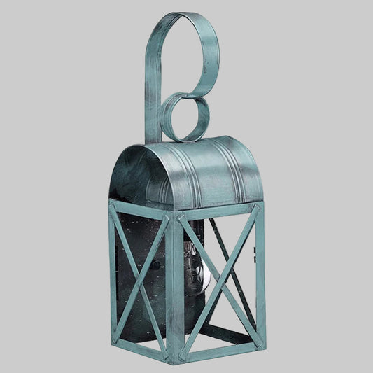 Decorative metal lantern with a handle on a gray background
