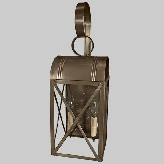 Bronze wall-mounted lantern with a gray background