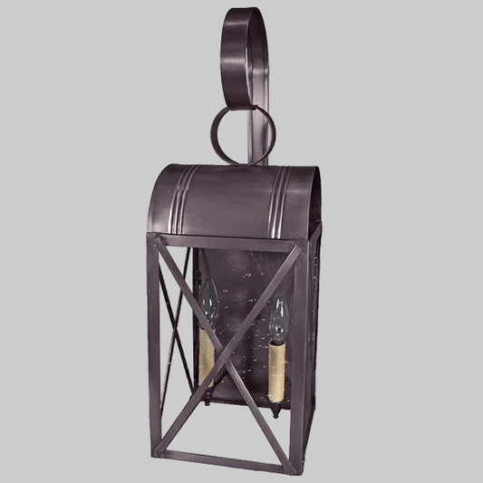 Decorative wall lantern with metal frame on a gray background