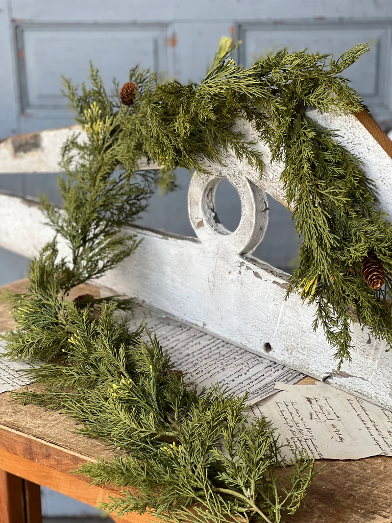 Greenery on a wooden surface with a rustic background