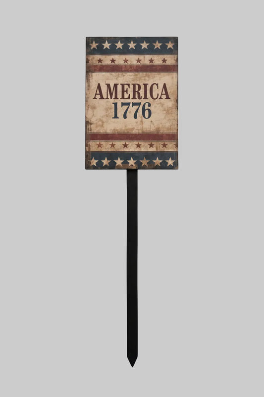 Decorative sign with 'America 1776' on a textured surface