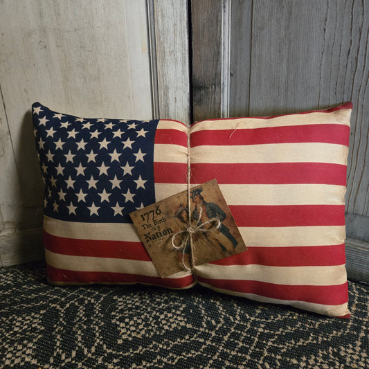 American flag pillow with vintage tag.