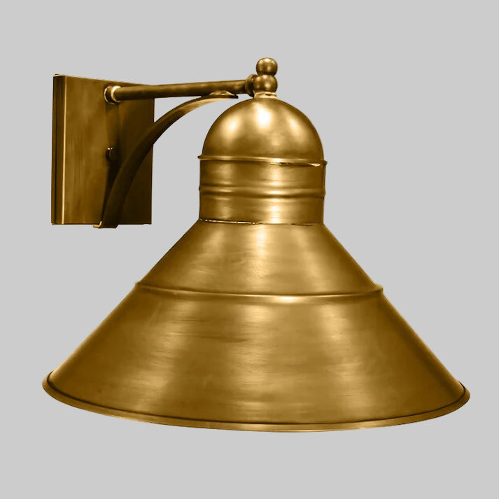 Brass wall-mounted light fixture on a white background