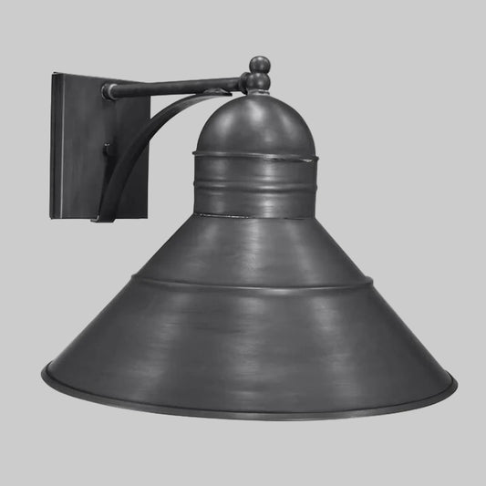 Vintage-style wall-mounted light fixture on a gray background