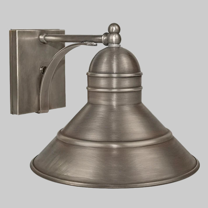 Brass wall-mounted light fixture on a gray background