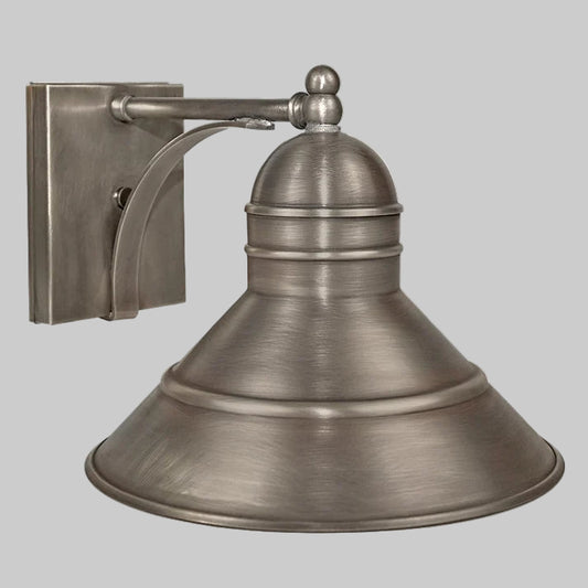 Brass wall-mounted light fixture on a gray background